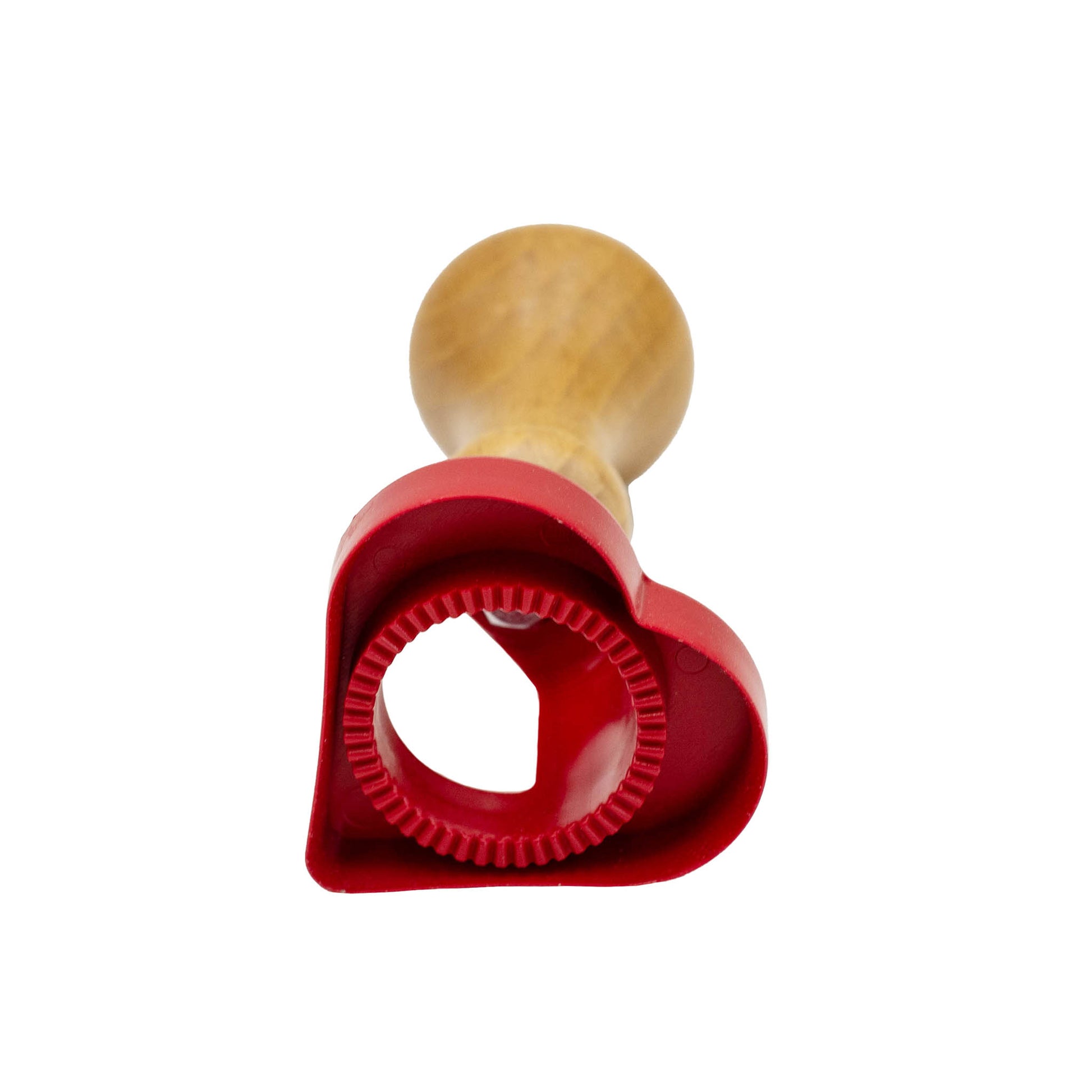 Red plastic heart shape biscuit and pasta cutter with wooden handle.
