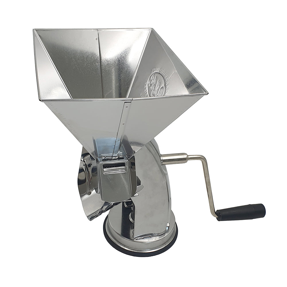 Metallic manual tomato mill on a white background