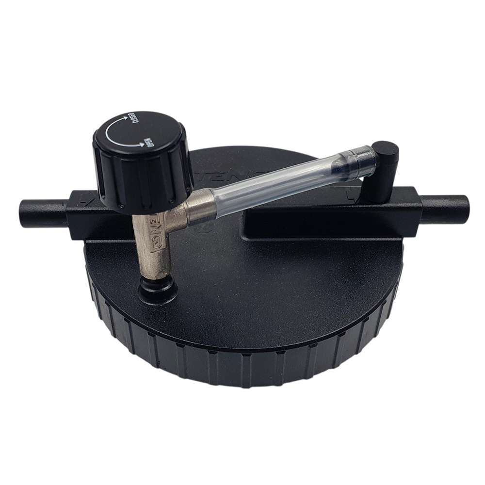 black plastic lid for the tandem filter housing on a enolmatic filler on white background