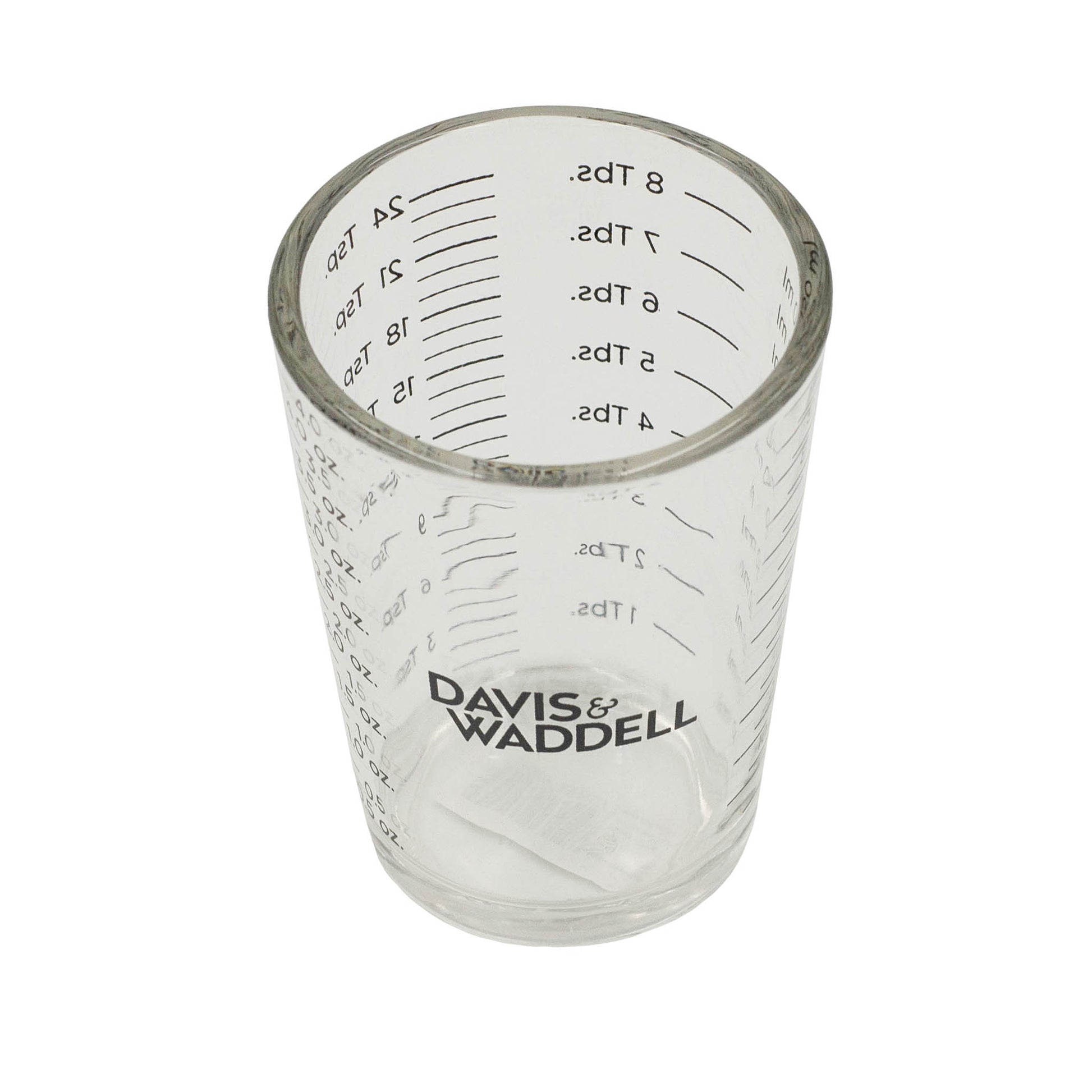 Glass measuring cup. Measurements in millimetres, ounces, teaspoon and tablespoon.