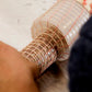 Applying the netting to the salami with the use of the netting tube applicator or torpedo